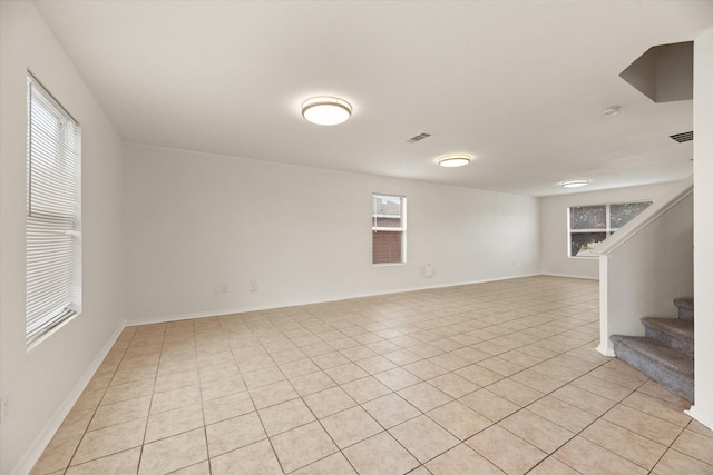 unfurnished room featuring light tile patterned floors