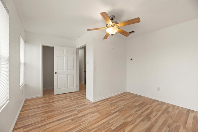 unfurnished room featuring ceiling fan and light hardwood / wood-style flooring