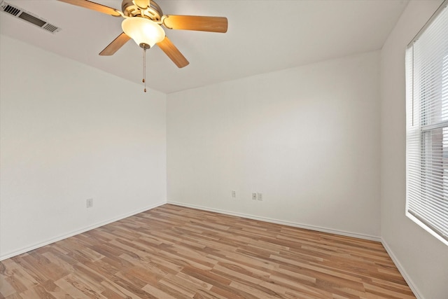 empty room featuring ceiling fan and light wood-type flooring