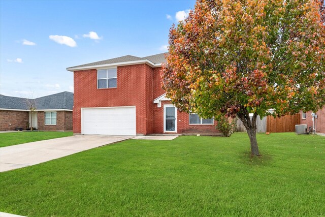 view of front of house with a front lawn, cooling unit, and a garage