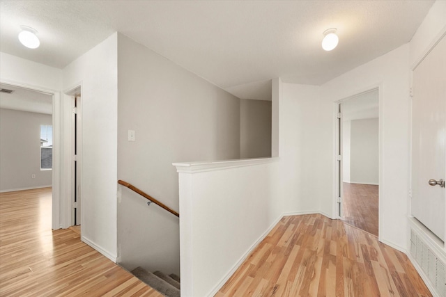 hallway featuring light hardwood / wood-style flooring