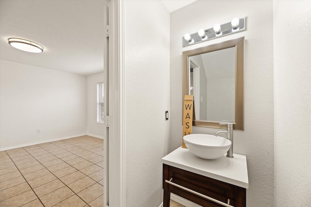 bathroom with tile patterned floors and vanity