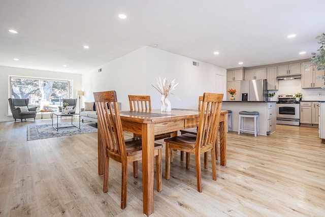 dining space featuring light hardwood / wood-style floors