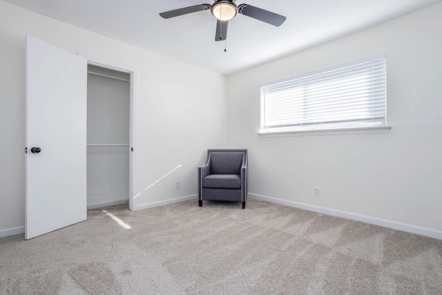 unfurnished room with ceiling fan and light colored carpet