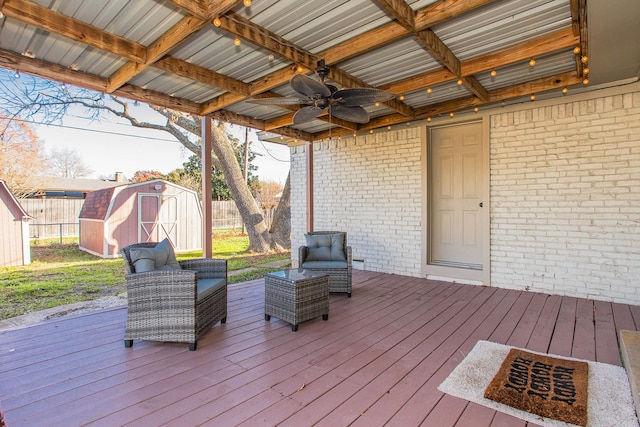 deck with a storage unit and ceiling fan