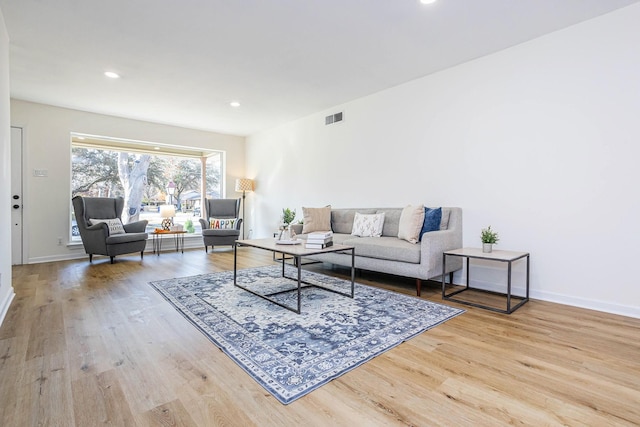 living room with light hardwood / wood-style floors