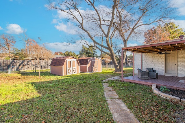 view of yard featuring a storage shed and a deck