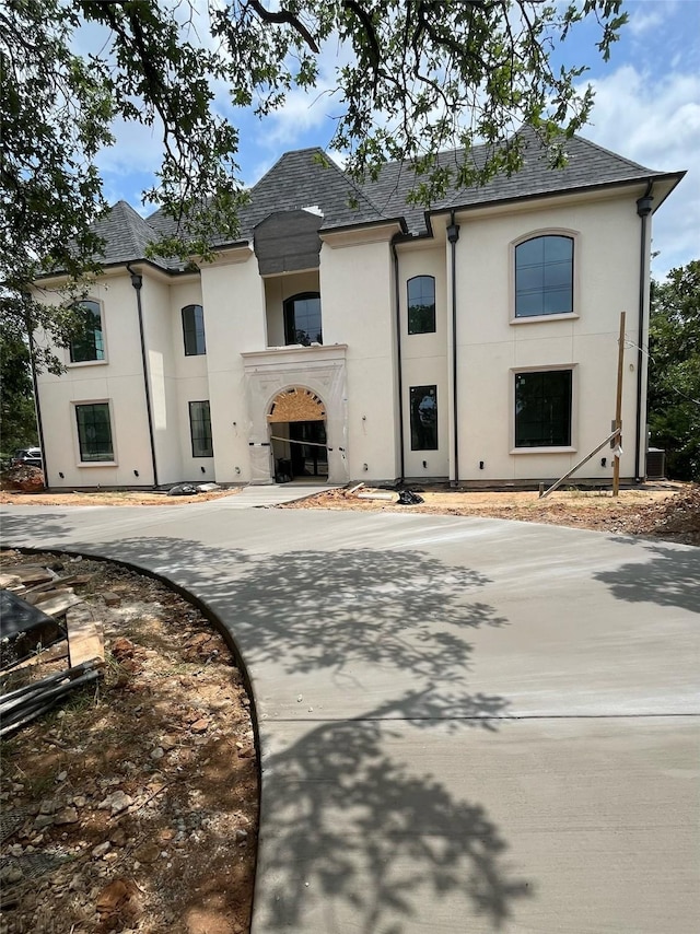 1133 Bourland Rd, Keller, TX 76248 - french country inspired facade with stucco siding, curved driveway, and a shingled roof