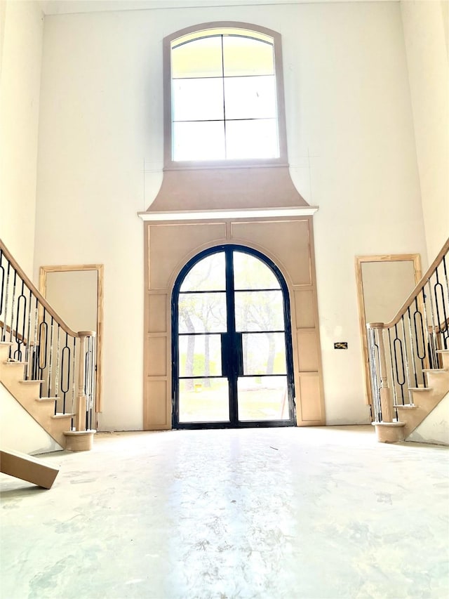 1133 Bourland Rd, Keller, TX 76248 - entrance foyer featuring a high ceiling, stairway, plenty of natural light, and arched walkways