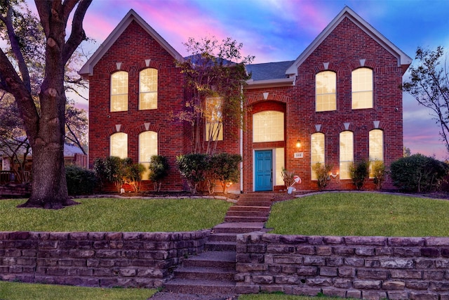 view of front of house with a yard