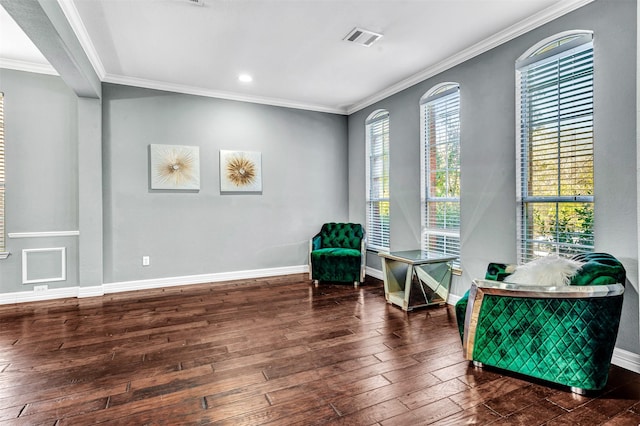 living area featuring dark hardwood / wood-style flooring and crown molding