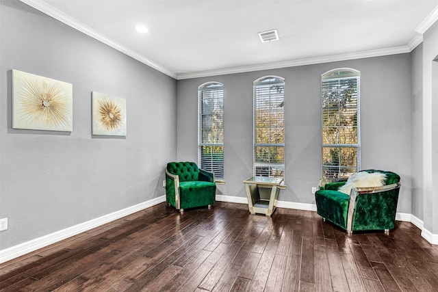 living area with dark hardwood / wood-style flooring and ornamental molding