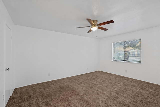 spare room with carpet flooring and ceiling fan