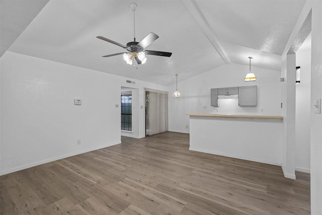 unfurnished living room featuring ceiling fan, wood-type flooring, and lofted ceiling