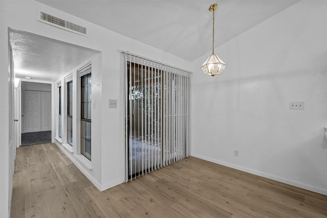 empty room featuring hardwood / wood-style flooring