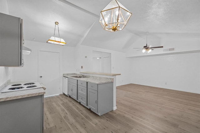 kitchen featuring gray cabinetry, pendant lighting, white appliances, ceiling fan with notable chandelier, and vaulted ceiling