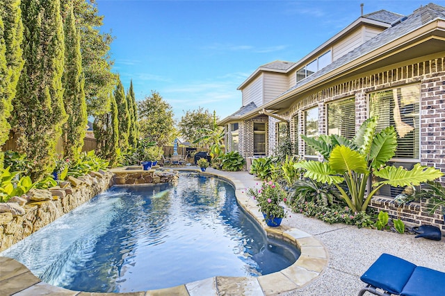 view of swimming pool with pool water feature