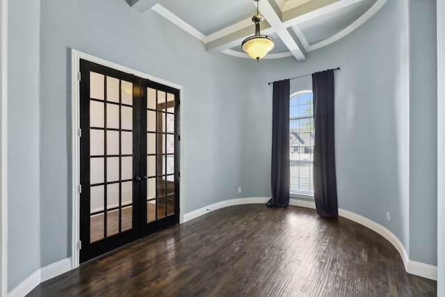 unfurnished room featuring french doors, dark hardwood / wood-style flooring, beam ceiling, ornamental molding, and coffered ceiling