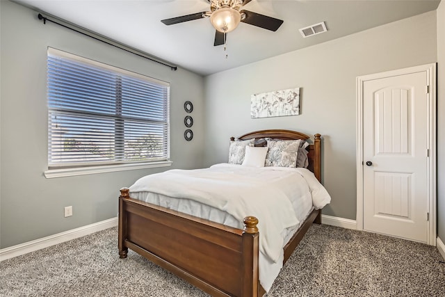 bedroom featuring ceiling fan and carpet