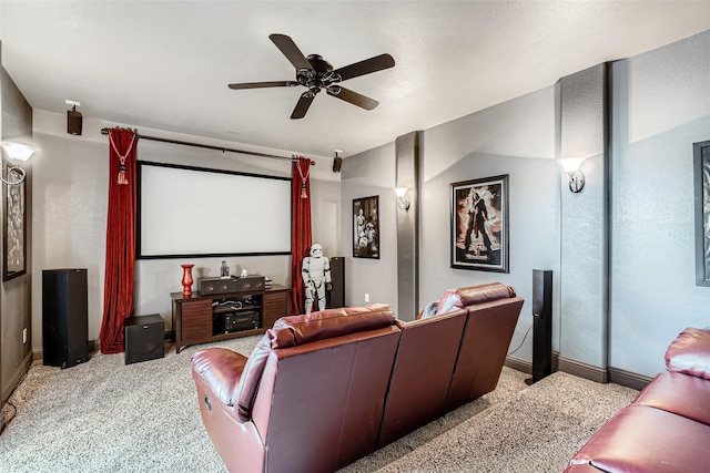 cinema room featuring light colored carpet and ceiling fan