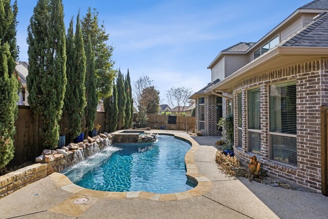 view of swimming pool featuring pool water feature