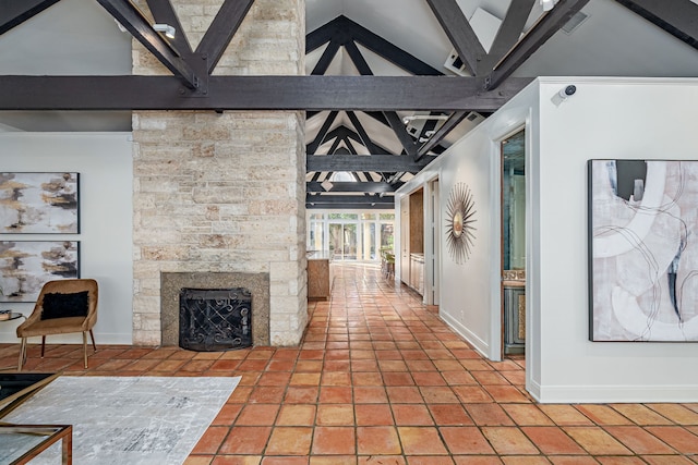 corridor with beamed ceiling, tile patterned flooring, and high vaulted ceiling