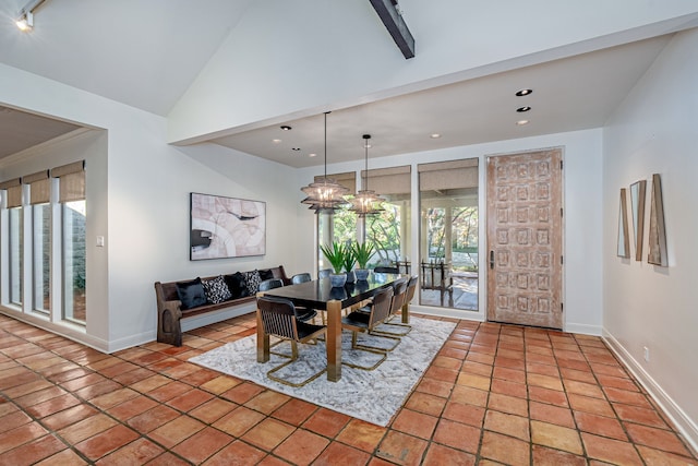 tiled dining space featuring high vaulted ceiling