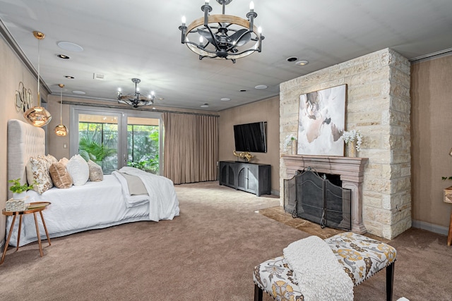 carpeted bedroom featuring ornamental molding, a stone fireplace, and a notable chandelier