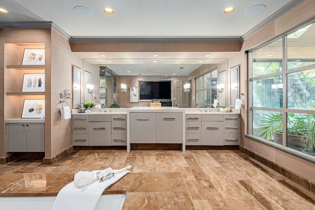 bathroom with vanity and ornamental molding