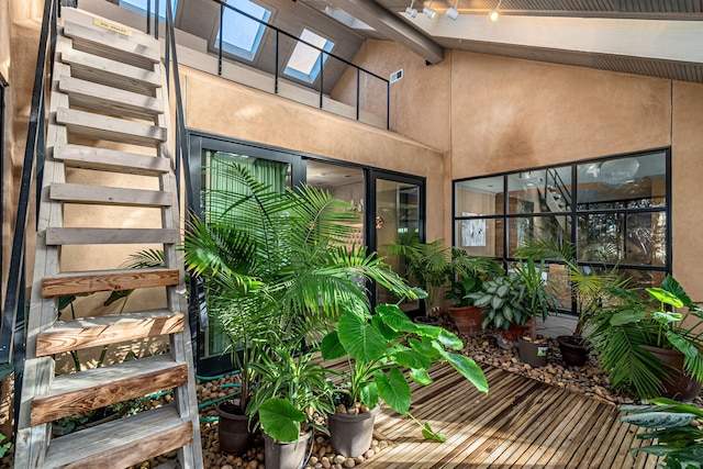 interior space with lofted ceiling with skylight