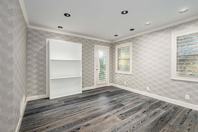 unfurnished room featuring dark wood-type flooring and ornamental molding