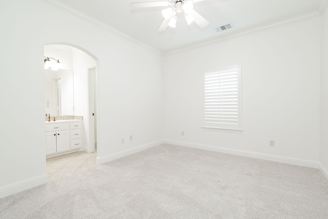 unfurnished room featuring light carpet, crown molding, ceiling fan, and sink