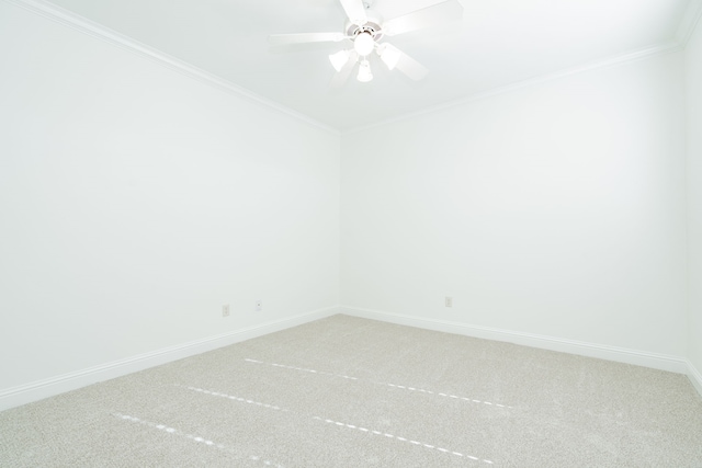 unfurnished room with carpet flooring, ceiling fan, and ornamental molding