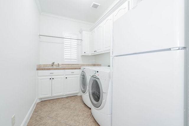 laundry room with cabinets, sink, separate washer and dryer, light tile patterned floors, and ornamental molding