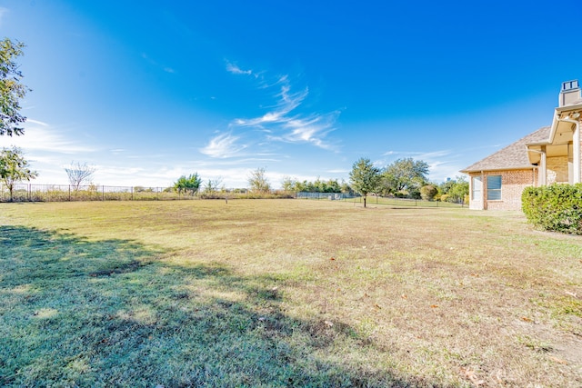 view of yard with a rural view