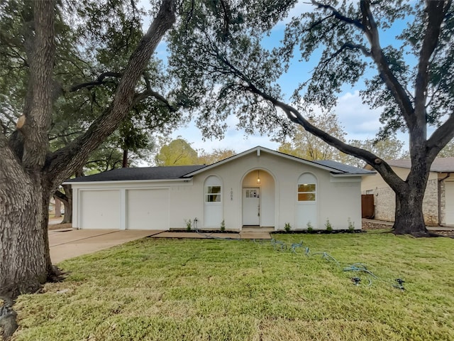 ranch-style house with a front yard and a garage