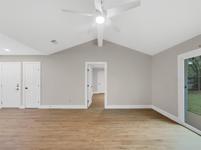 unfurnished room featuring ceiling fan, lofted ceiling with beams, and light hardwood / wood-style flooring