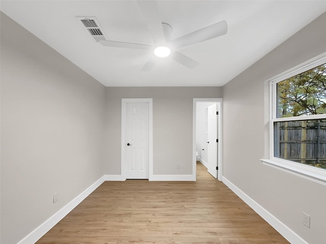 unfurnished bedroom featuring ceiling fan and light wood-type flooring