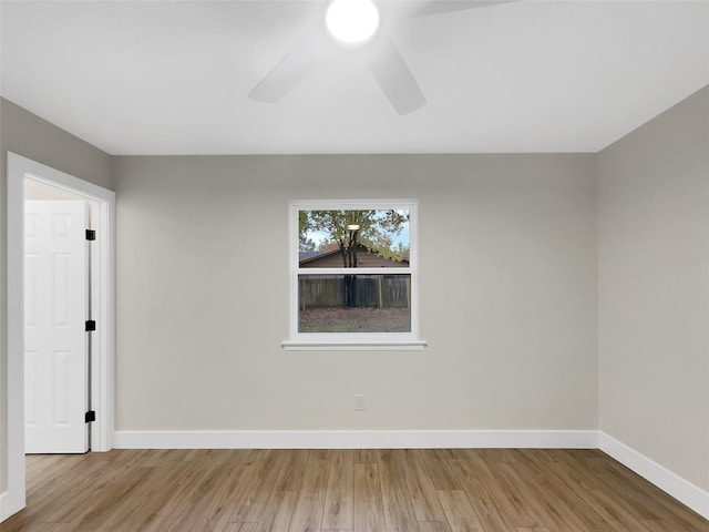 spare room featuring hardwood / wood-style flooring and ceiling fan