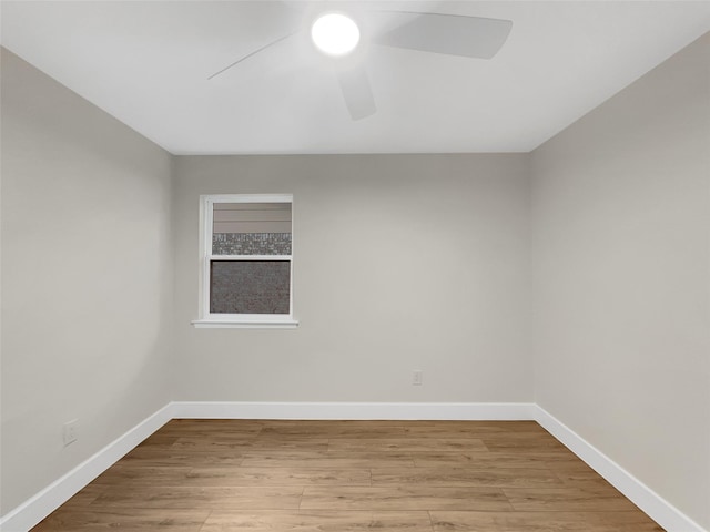 empty room featuring ceiling fan and light wood-type flooring