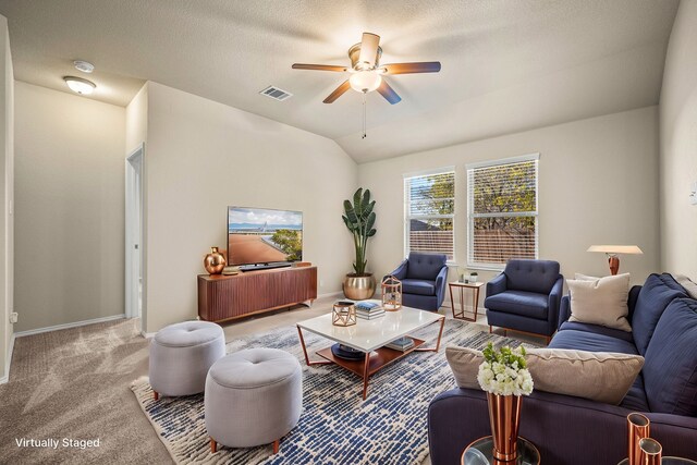 unfurnished living room featuring light colored carpet and ceiling fan