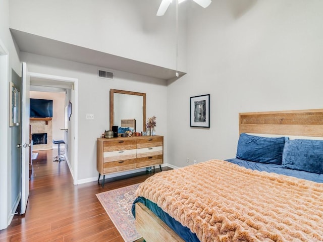 bedroom with ceiling fan and hardwood / wood-style floors