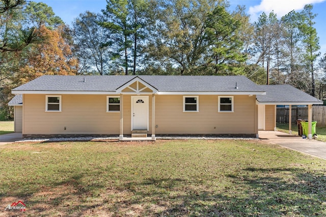 ranch-style home featuring a front yard and a carport