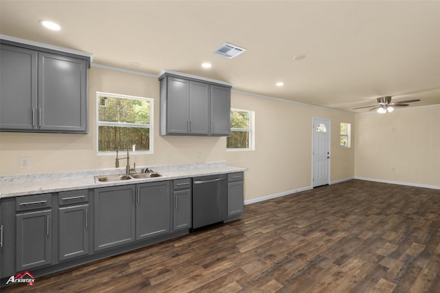 kitchen with gray cabinetry, a wealth of natural light, dishwasher, sink, and dark wood-type flooring