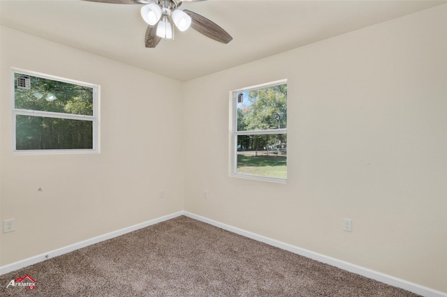 spare room with carpet floors and ceiling fan