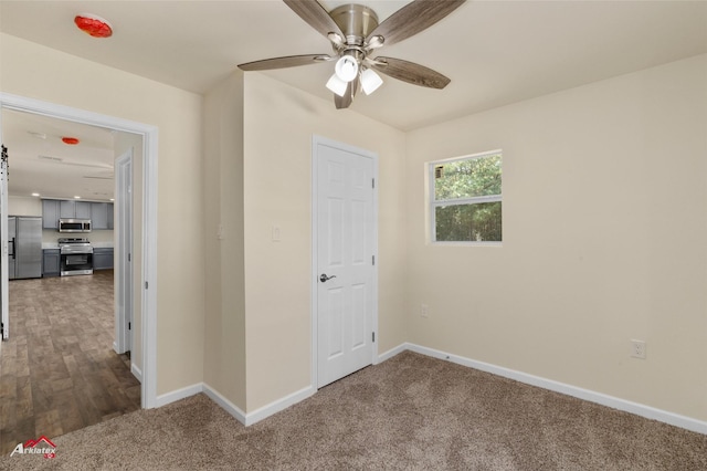 interior space featuring dark hardwood / wood-style floors and ceiling fan