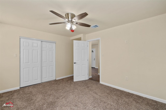 unfurnished bedroom featuring carpet, a closet, and ceiling fan