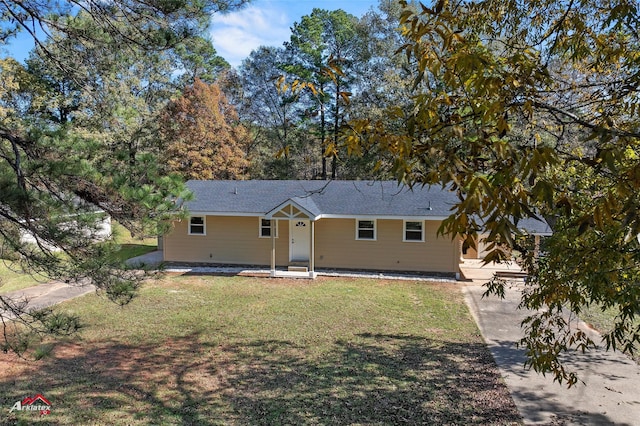 back of house featuring a yard