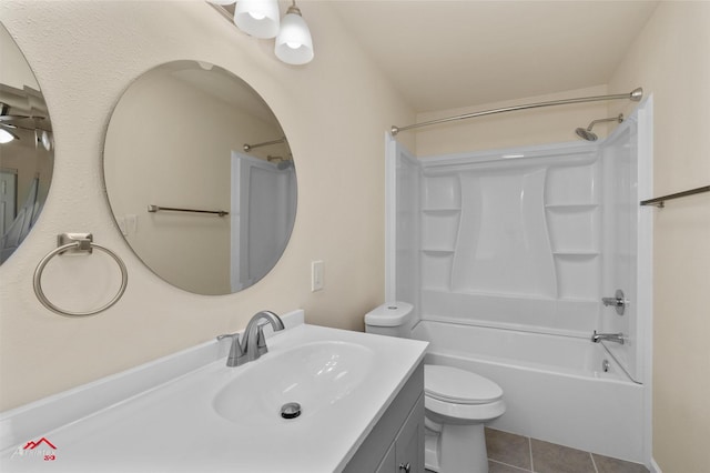 full bathroom featuring tile patterned floors, vanity, bathing tub / shower combination, and toilet