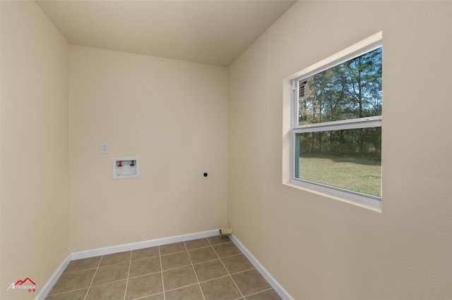 clothes washing area featuring hookup for an electric dryer, light tile patterned floors, a healthy amount of sunlight, and washer hookup